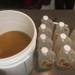 Adding apple cider to brewing bucket
