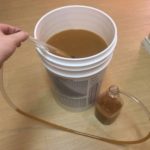 Syphoning out the fermented cider